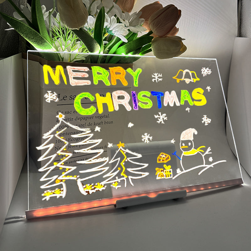 Decorative LED sign with 'Merry Christmas' text and festive illustrations on a stand.
